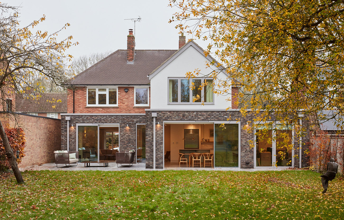 Luna House exterior view of contemporary extension with grey brickwork and render