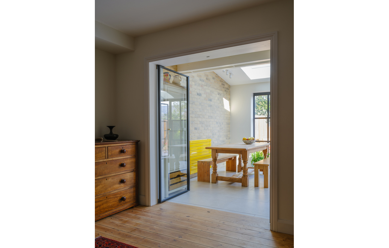 View through to extension at House for a Musician with slim framed doors